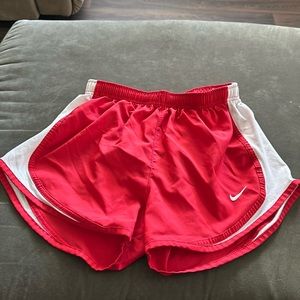 Red, small Nike running shorts